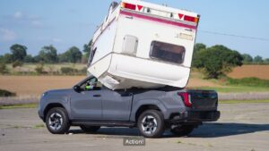 Toyota Drops a Caravan on Its Electric Hilux